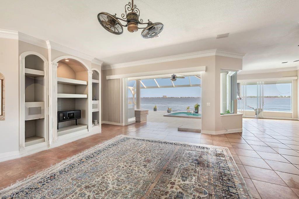 GREAT ROOM FACING SLIDERS TO LANAI W/RIVER IN DISTANCE - VIEW 2