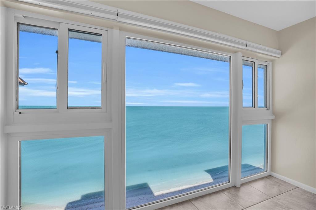 Expansive window-wall system offering panoramic water and sky scenery