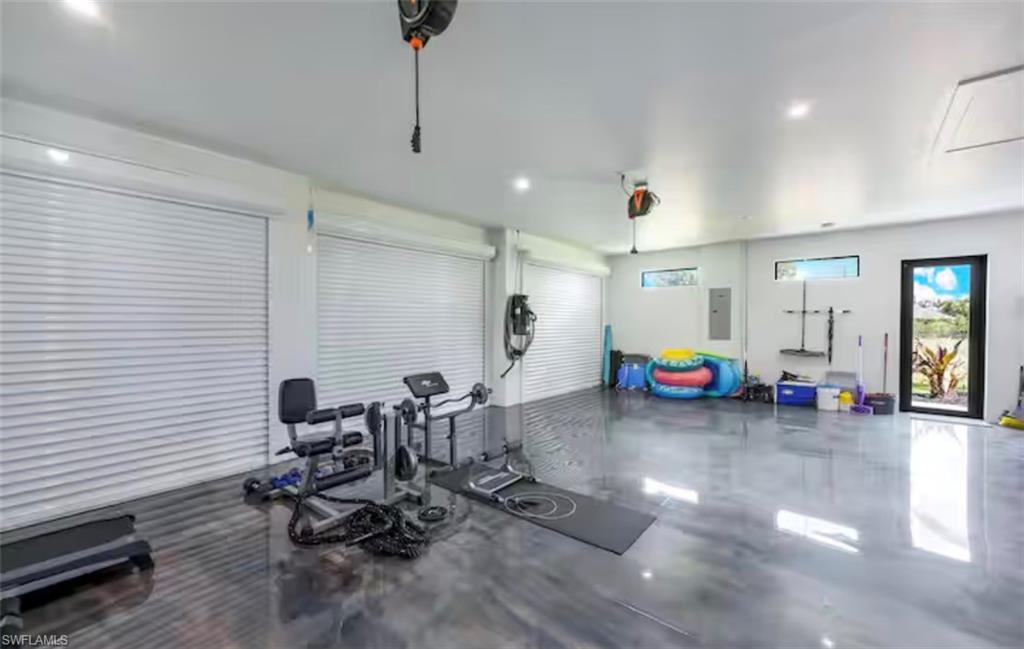Exercise room featuring recessed lighting