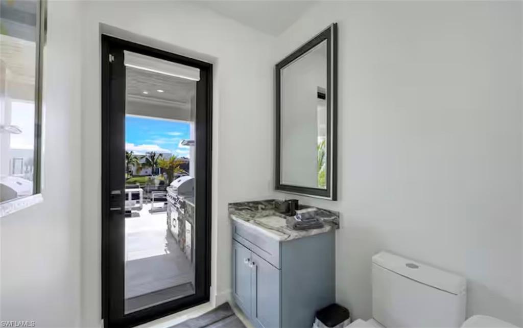 Bathroom featuring vanity and toilet