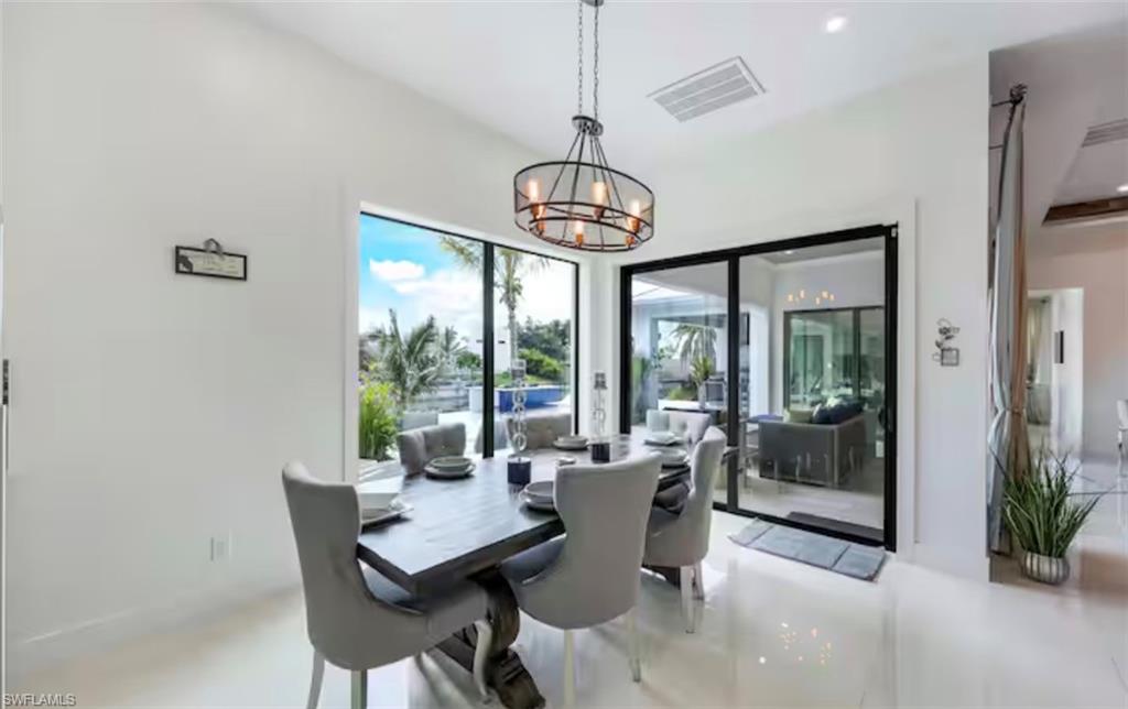 Dining area featuring suspended lighting