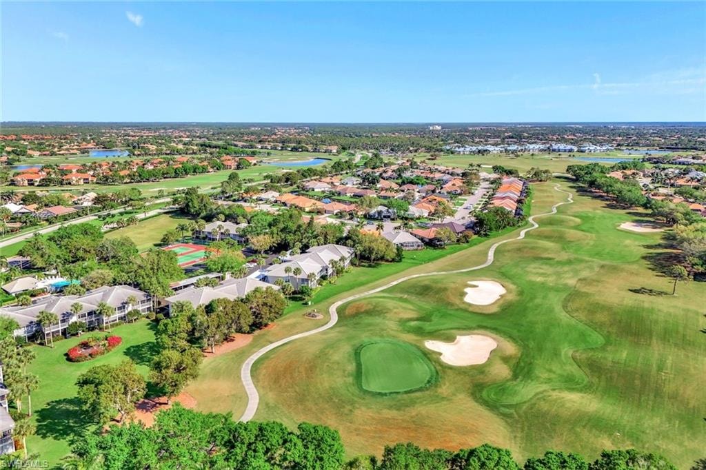 Expansive golf course property featuring green fairways, sand traps, and a putting green