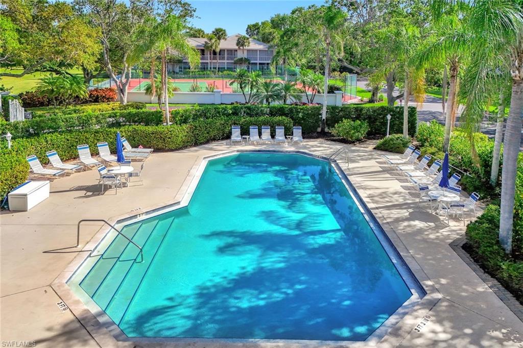 Outdoor swimming pool with integrated steps and concrete decking