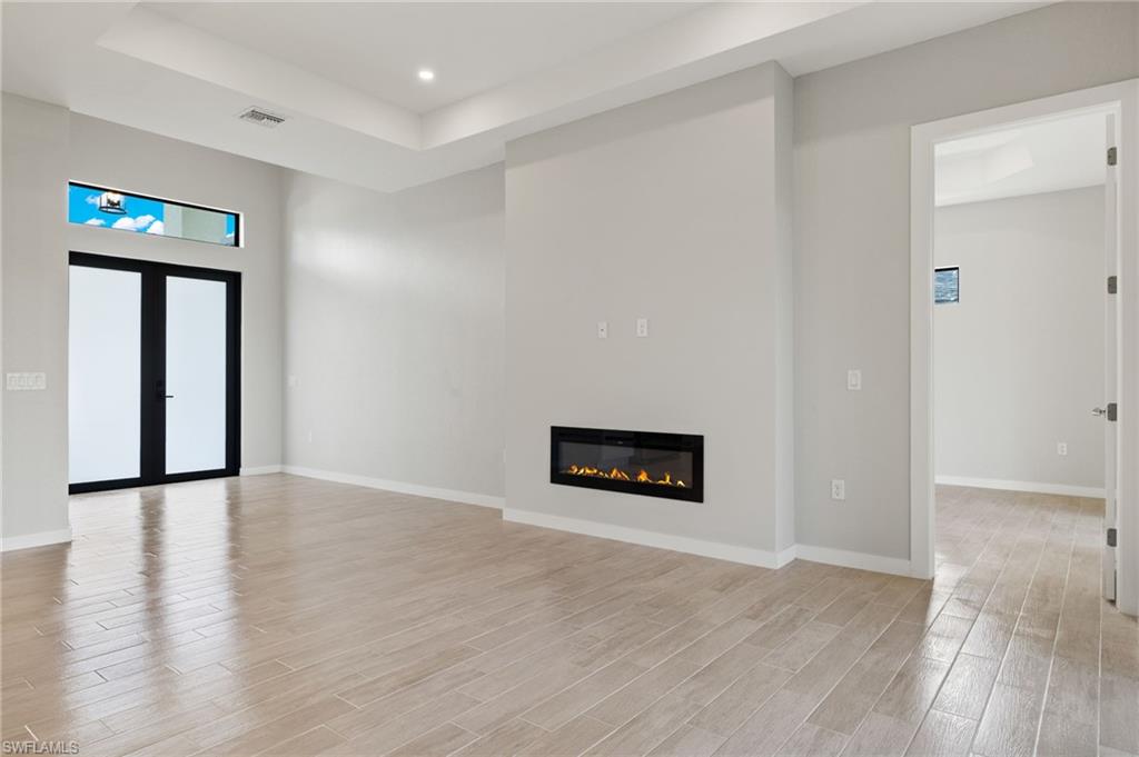 Flooring upgraded to premium, color-matched Luxury Vinyl Plank [LVP].