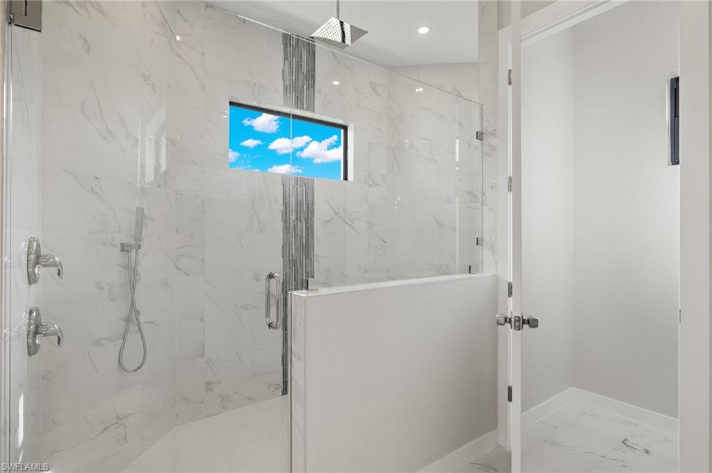 XL Shower with custom tile inlay & stainless rain showerhead