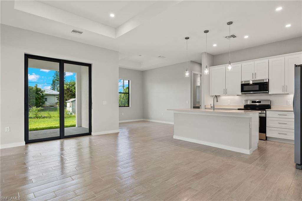 Flooring upgraded to premium, color-matched Luxury Vinyl Plank [LVP].