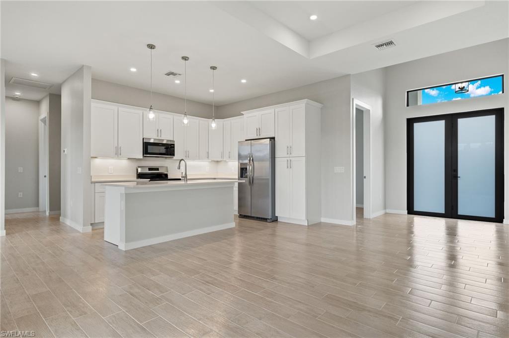 Flooring upgraded to premium, color-matched Luxury Vinyl Plank [LVP].