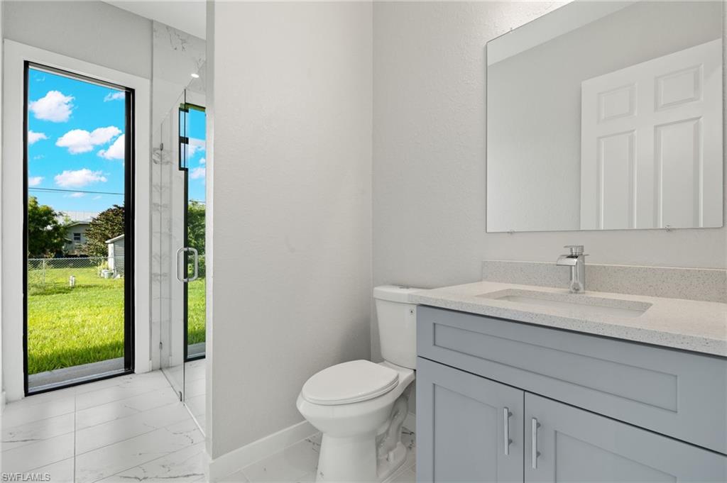 Custom Glass Shower plus separate access to backyard.