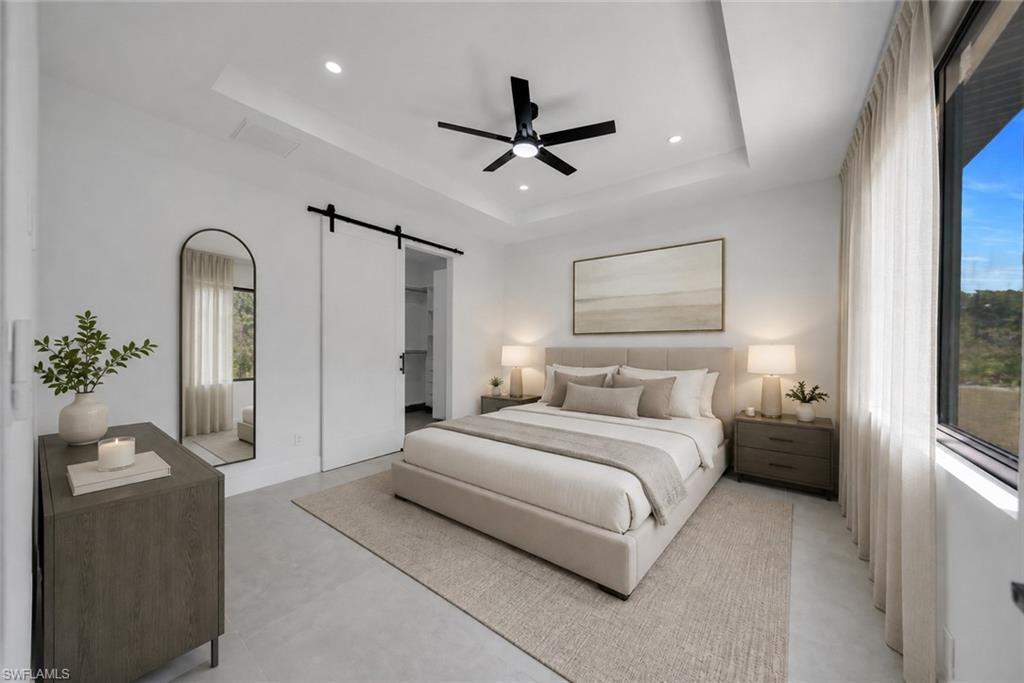 Tray ceiling with recessed lighting and a ceiling fan