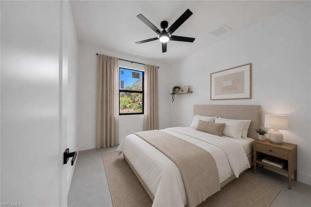 White painted walls, contemporary ceiling fan, dark-framed window, and a door with matte black hardware