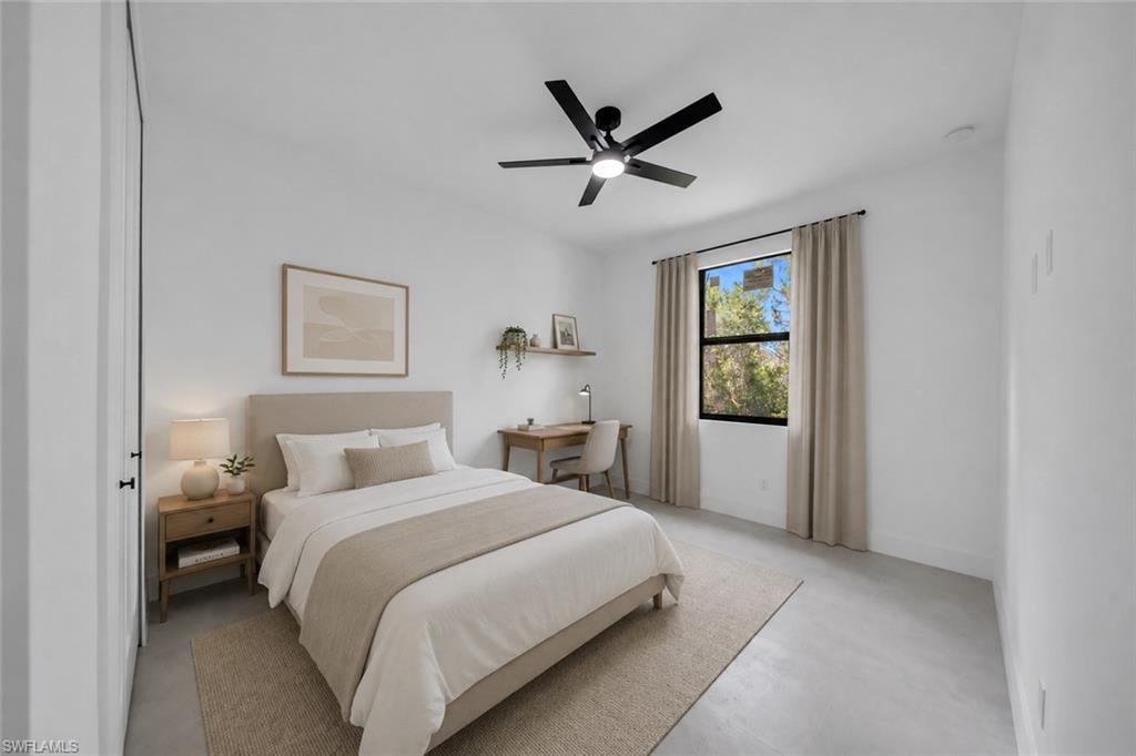 High ceilings and a modern ceiling fan with integrated lighting
