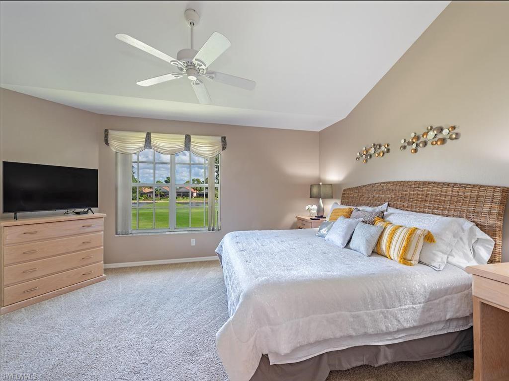 Spacious primary bedroom with access to the lanai and fabulous views