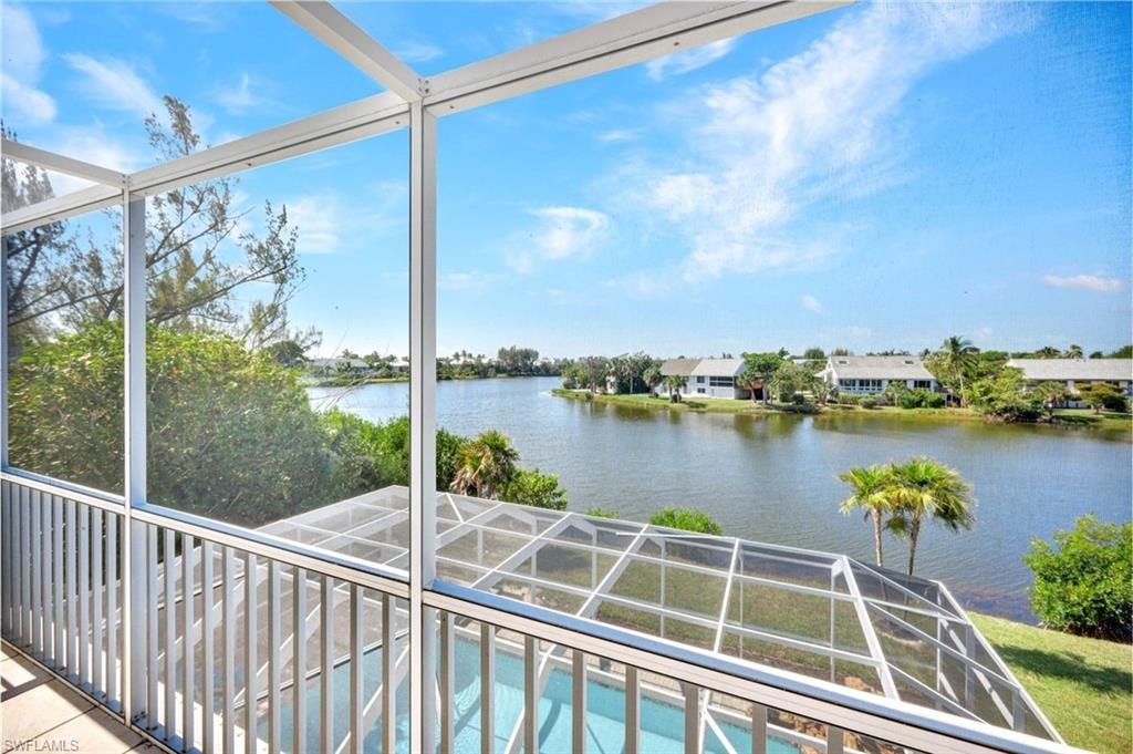 Screened balcony with lake frontage and a private screened pool enclosure