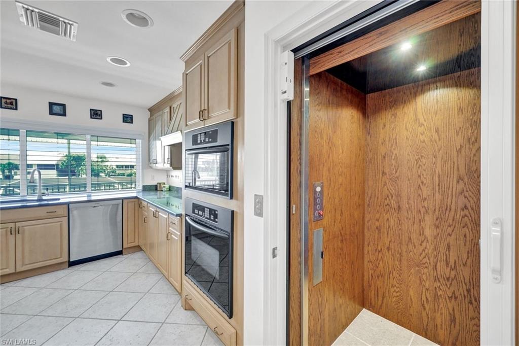 Wood-paneled private elevator with recessed lighting