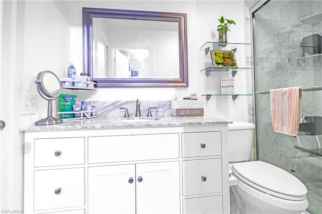 White vanity featuring brushed nickel hardware