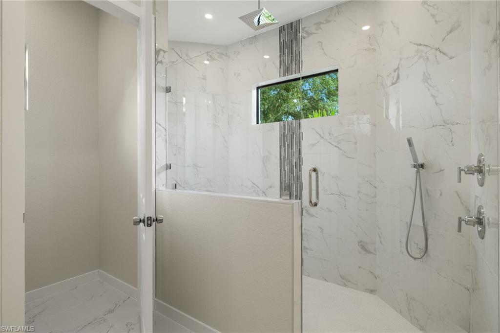 XL Shower with custom tile inlay & stainless rain showerhead