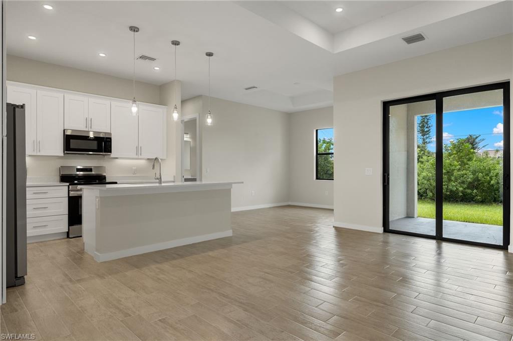 Flooring upgraded to premium, color-matched Luxury Vinyl Plank [LVP].
