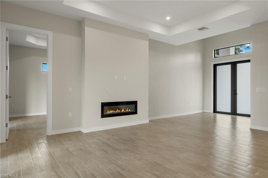 Flooring upgraded to premium, color-matched Luxury Vinyl Plank [LVP].