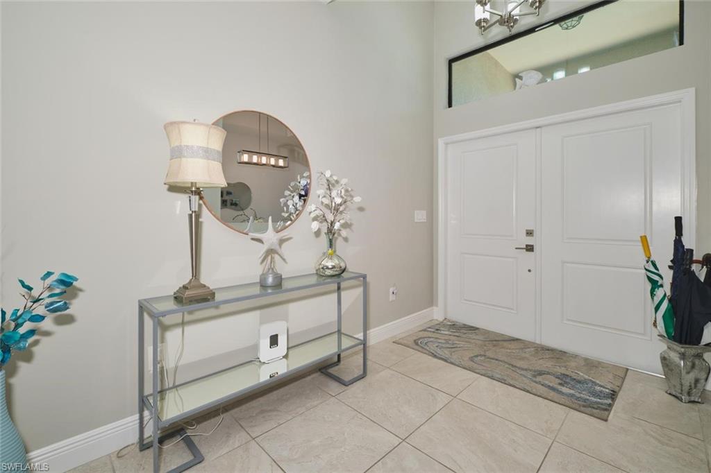 Entryway featuring a double door entry, transom window