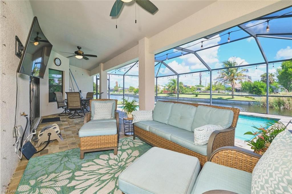 SCREENED LANAI  featuring a ceiling fan, recessed lighting, and a vaulted ceiling