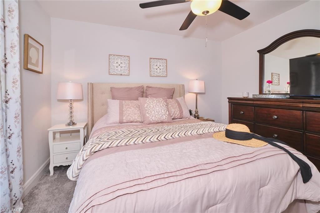 Bedroom featuring plush carpet flooring