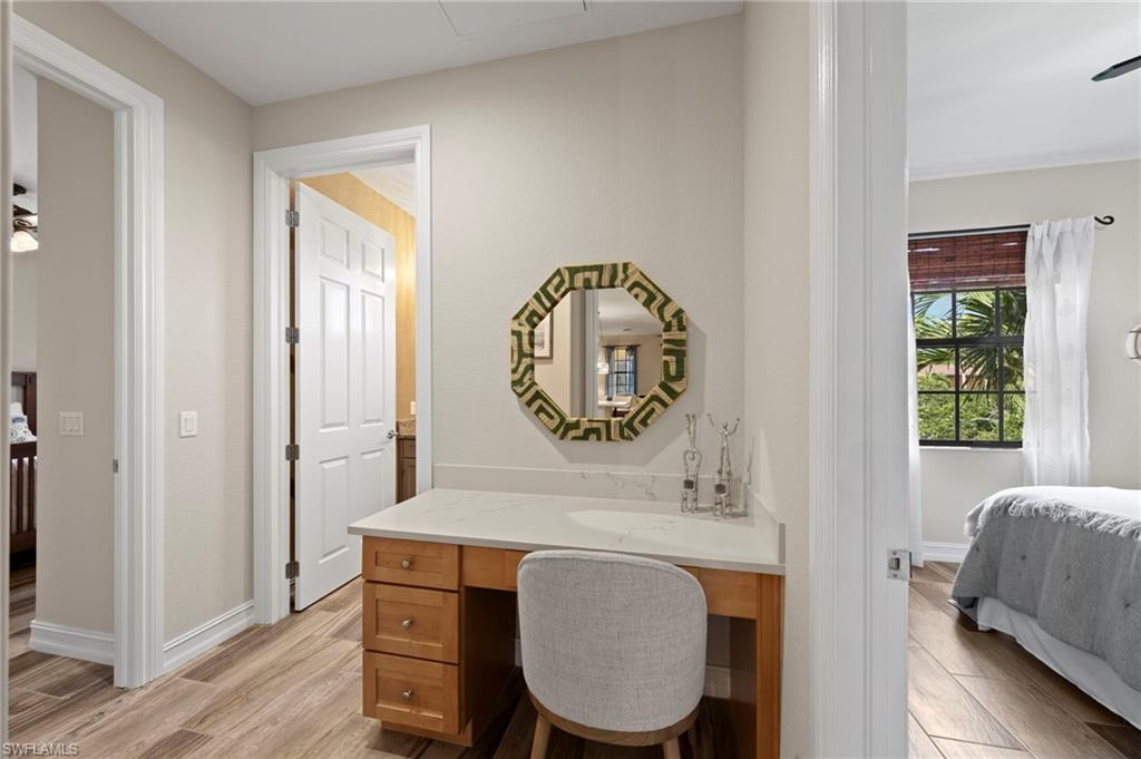 A workstation is conveniently located between the secondary bedrooms and can be closed off with a pocket door. NEW QUARTZ COUNTERS (2018), NEW TILE FLOOR (2018)