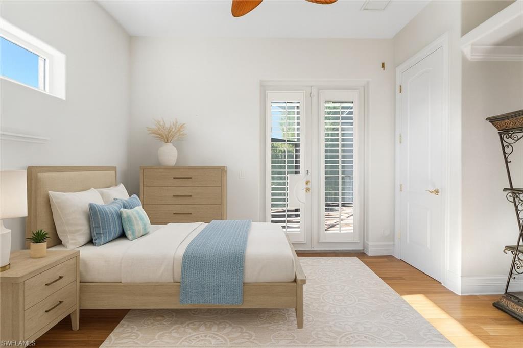 The third bedroom is a refined retreat, featuring elegant French double glass doors that open seamlessly to the lanai and pool, complemented by plantation shutters for added privacy and transom windows that bathe the space in soft natural light—creating the perfect setting to awaken to serene Southwest Florida mornings. 3rd bedroom is Virtually Staged.