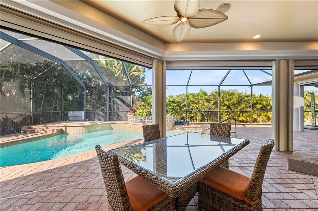 The sanctuary lanai offers an exceptional expanse of covered living space, perfectly designed for effortless year-round entertaining, all complemented by an elegantly pavered pool deck.