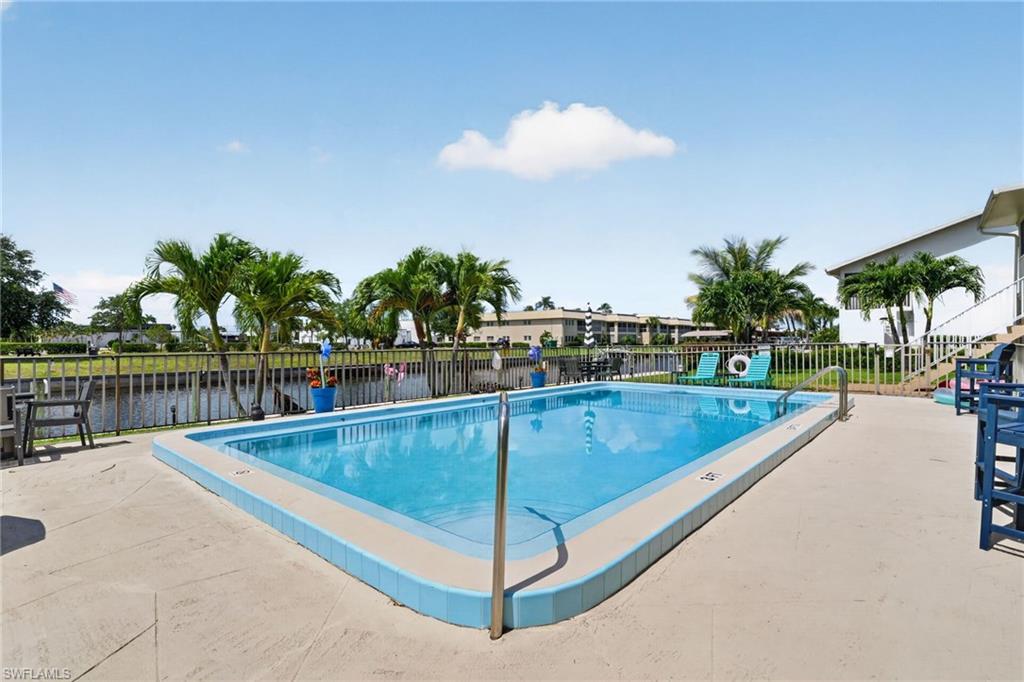 Outdoor swimming pool with integrated steps, surrounded by a concrete deck