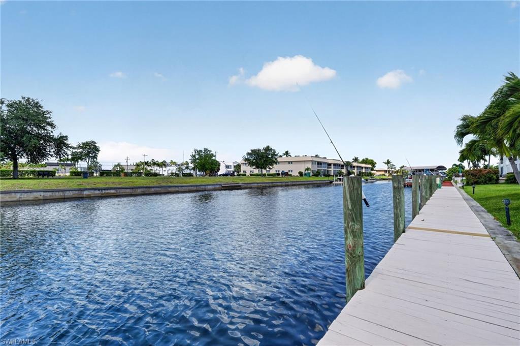 Private dock access featuring wood planking and vertical pilings