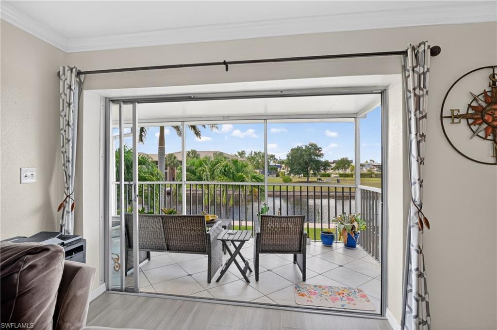 Screened balcony with tiled flooring and water frontage