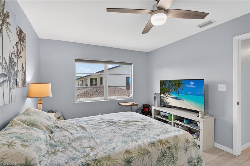Light blue painted walls with a window showcasing residential architecture