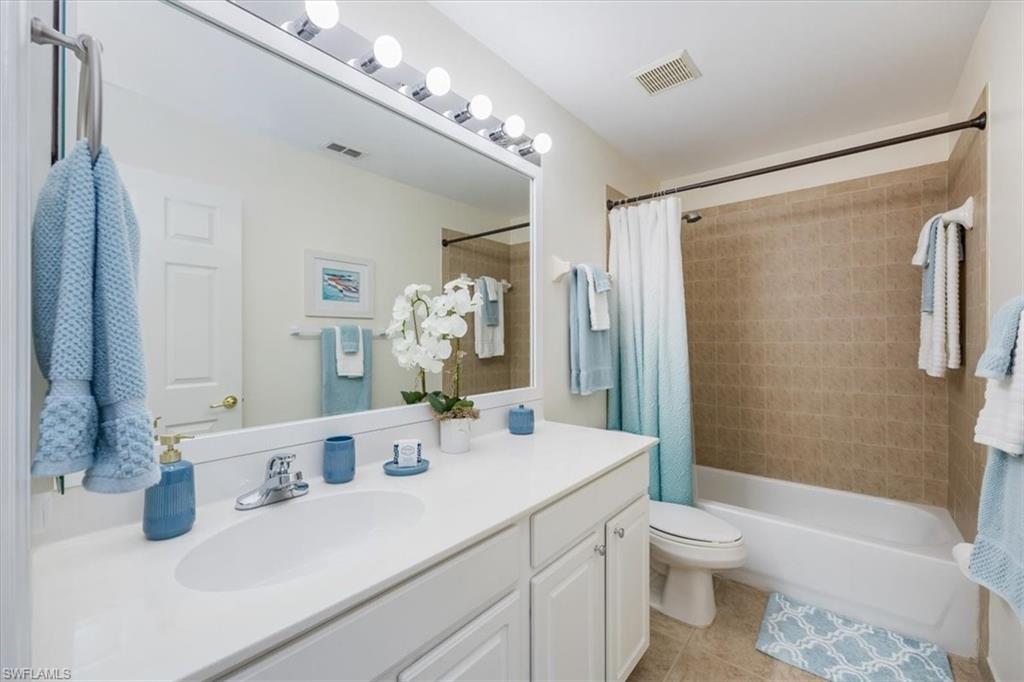 Beautifully updated framed mirror and new light fixture