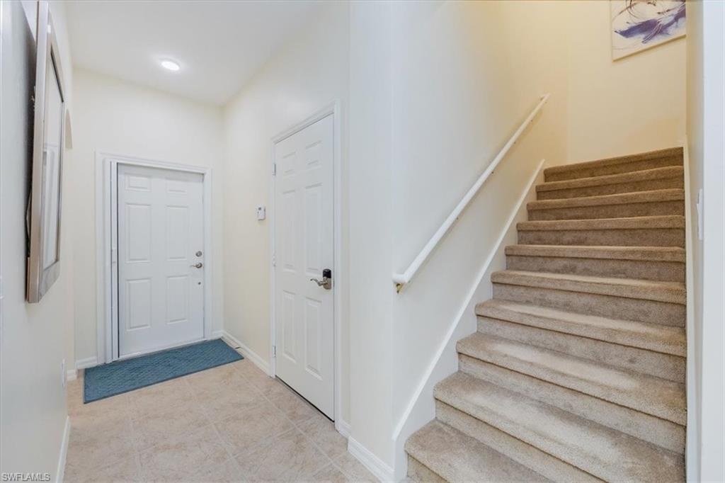 Front door, door to Garage and Stairs to 2nd floor