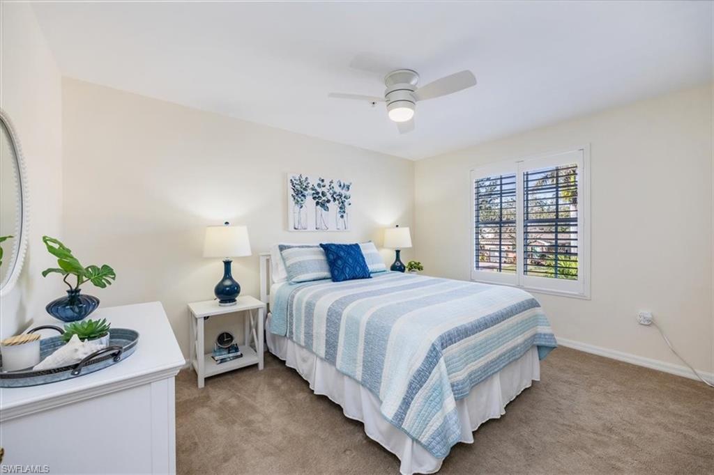Guest Bedroom w/new ceiling fan and plantation shutters