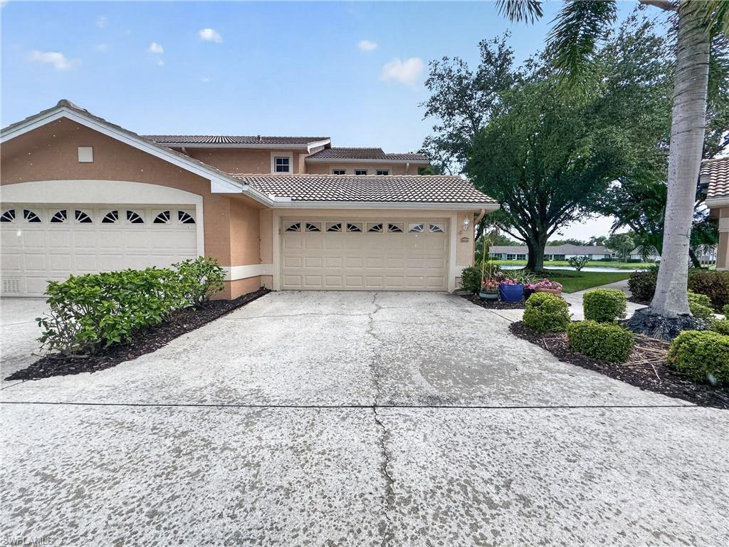 Driveway Entrance to Condo, 2 car Garage, automatic door opener.  Garage has pull down stairway allowing easy access to extra storage.
