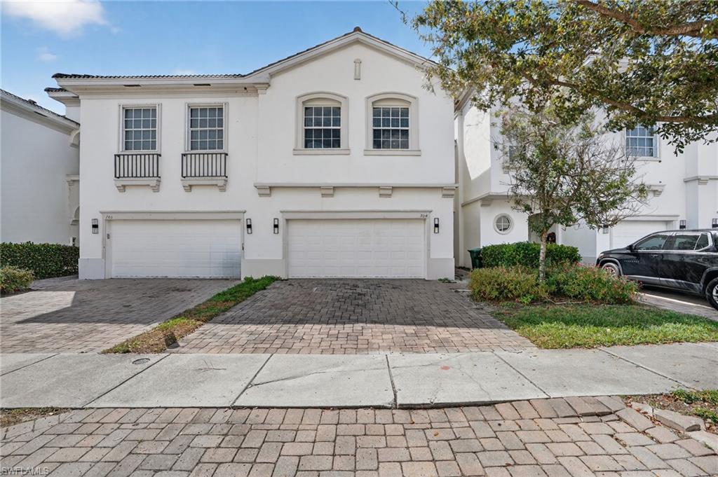 White stucco exterior with a tiled roof
