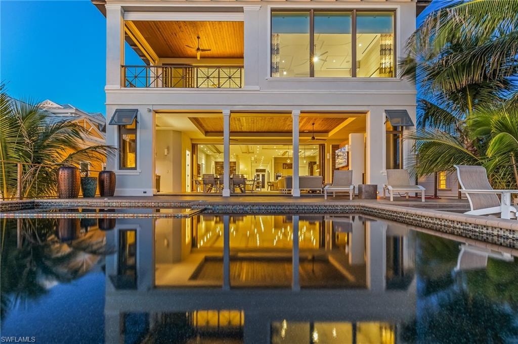 View of back of home at sunset
