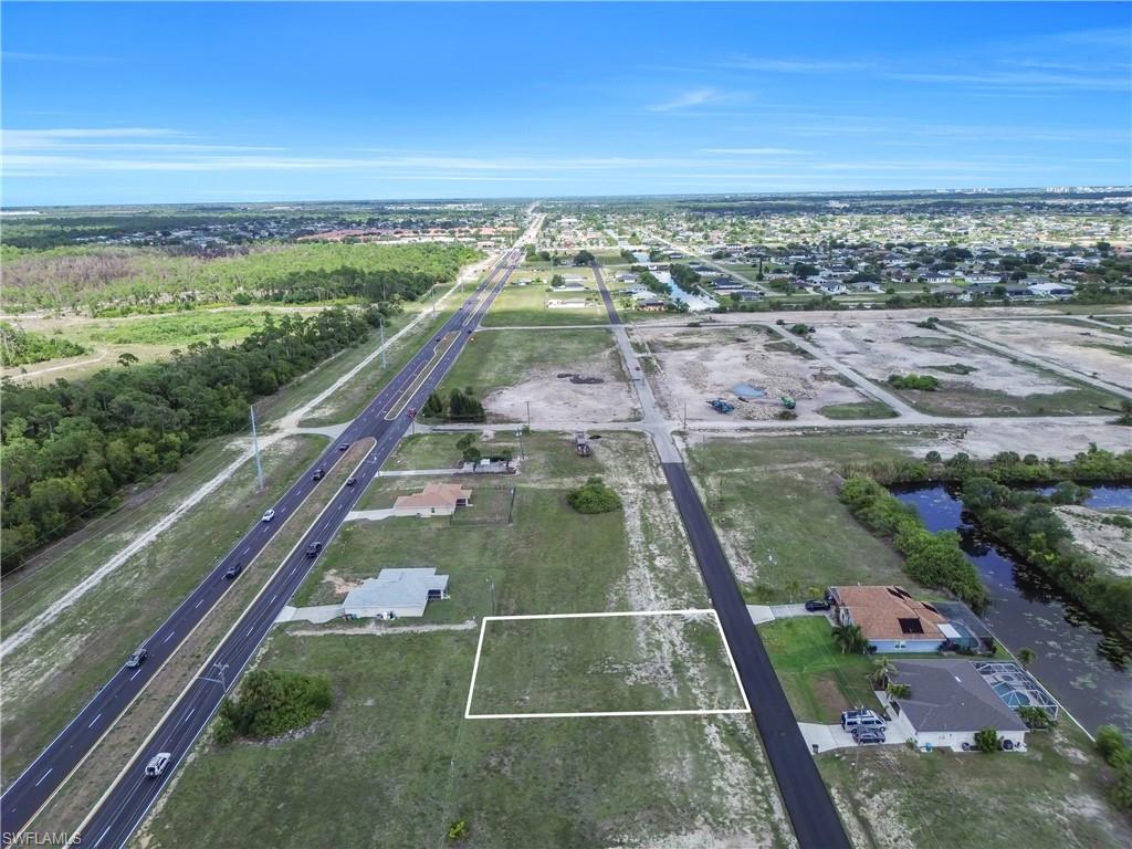 Vacant residential lot with clear boundaries marked by a white outline