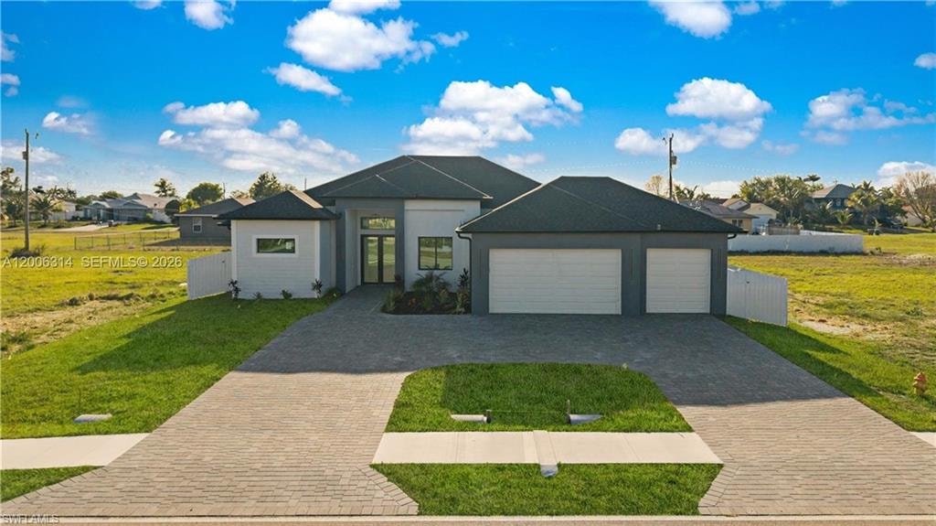 Modern single-story residence featuring a dark-tiled roof and a light gray and white exterior