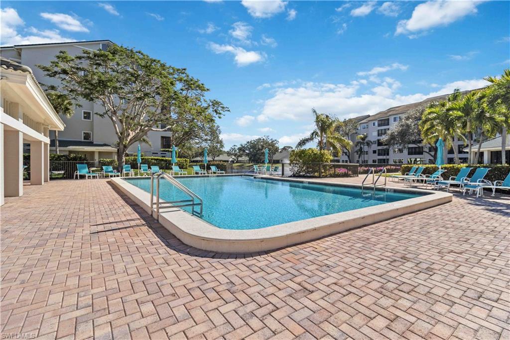 Community pool featuring a patio