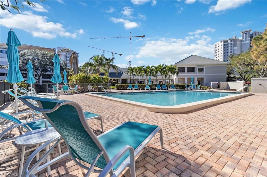Community pool with a patio area
