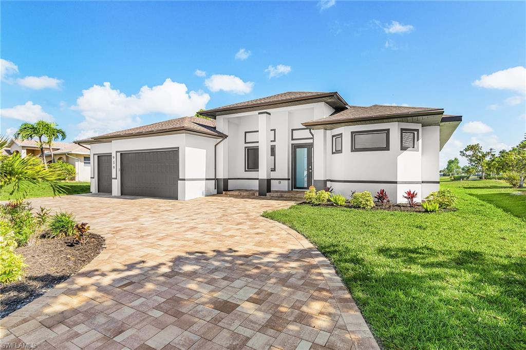 Contemporary exterior with a multi-tone paver driveway