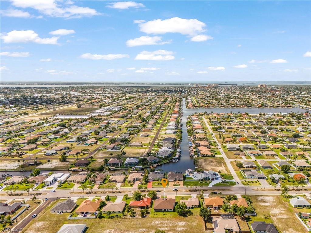 Aerial perspective showcasing a residential community with numerous single-story homes
