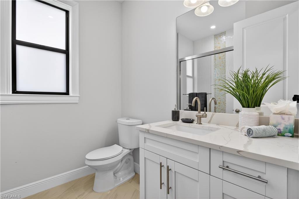 The SECOND BATHROOM features MODERN VANITY, DESIGNER TILE and TUB/SHOWER COMBINATION perfect for guests or family use.