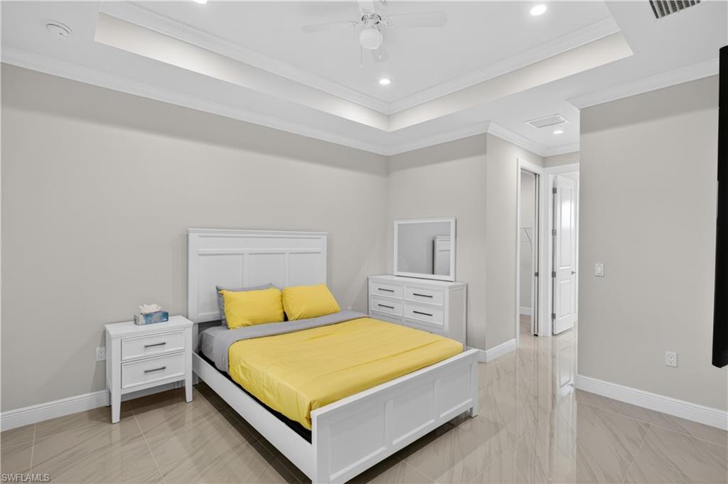 The PRIMARY SUITE offers a peaceful retreat with TRAY CEILINGS, LARGE WALK-IN CLOSET