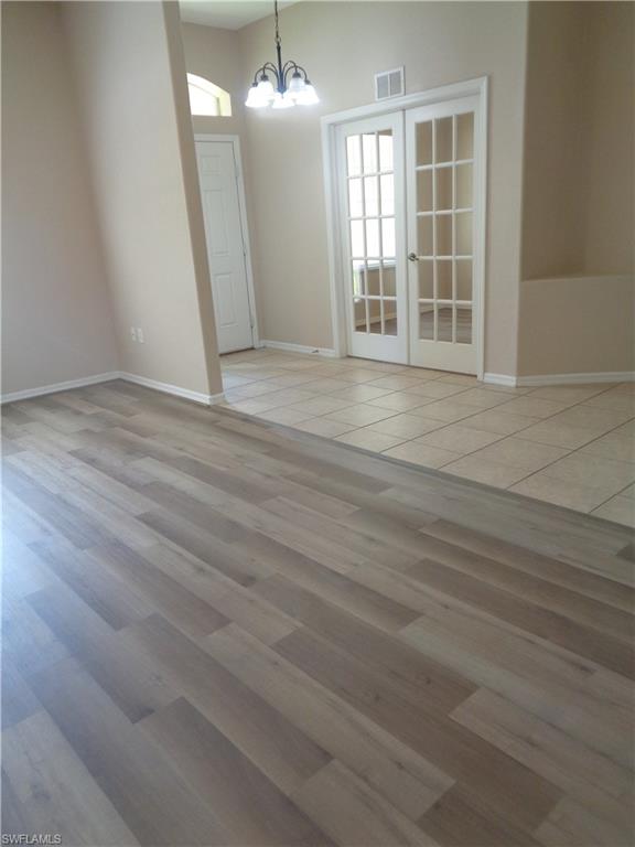 View of the Living Room and Den, featuring wood-style flooring and tile