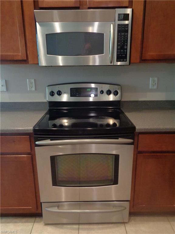 View of the stainless steel range/oven and microwave