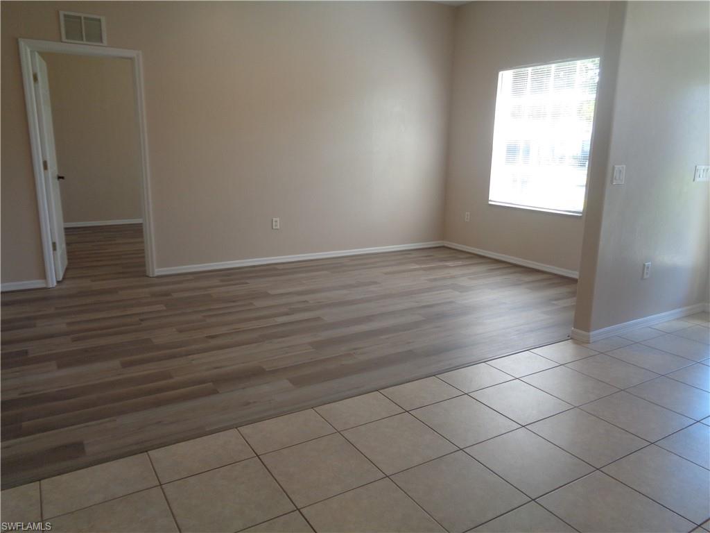View of the Living Room, featuring wood-style flooring and tile