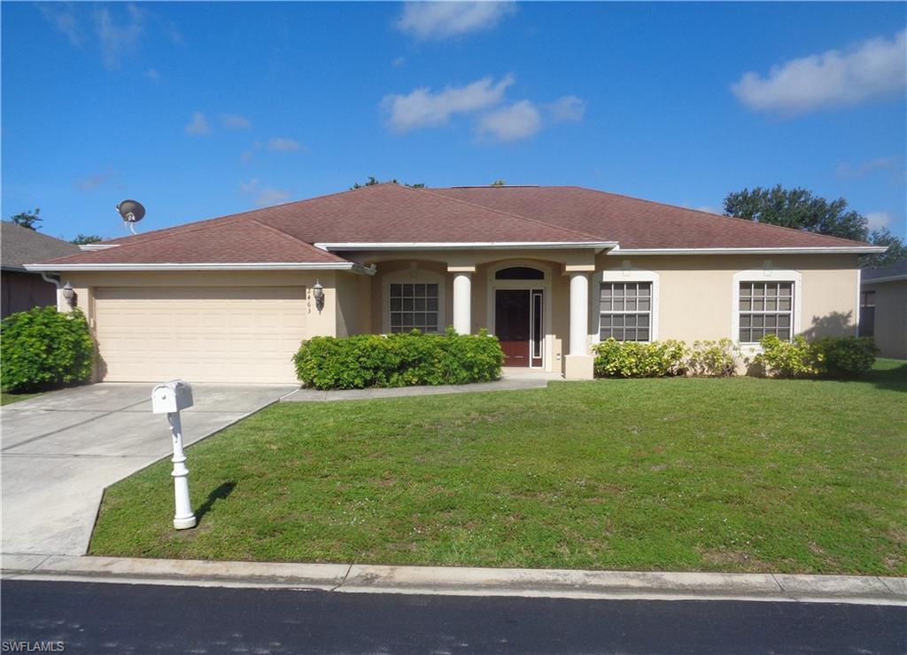 Front view of single-story home with a 2-car garage, driveway, shingle roof, and stucco siding